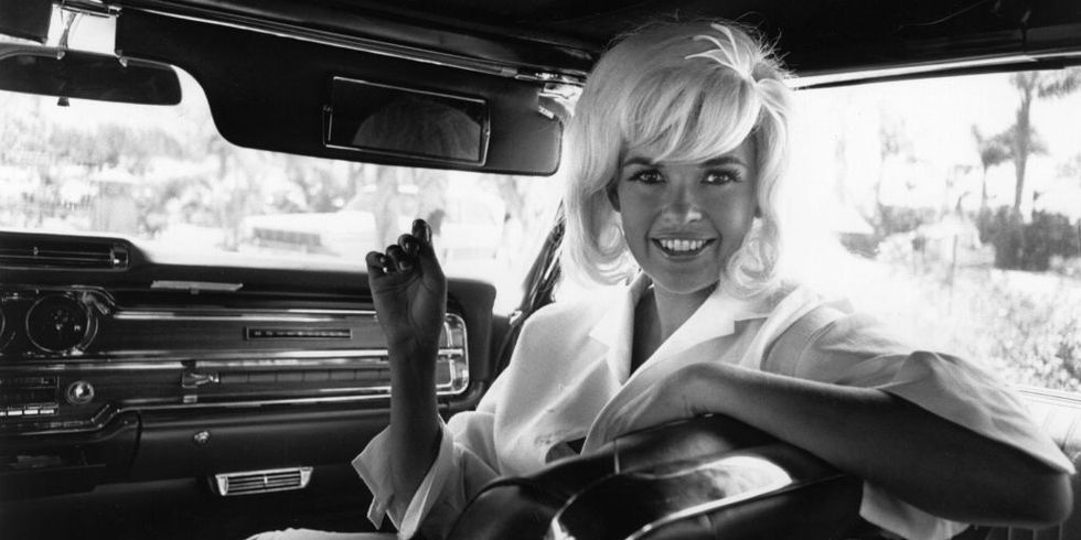 Vera Jane Palmer (1933-1967) better know as Jayne Mansfield, and American Actress, in the passenger seat of  a limousine.