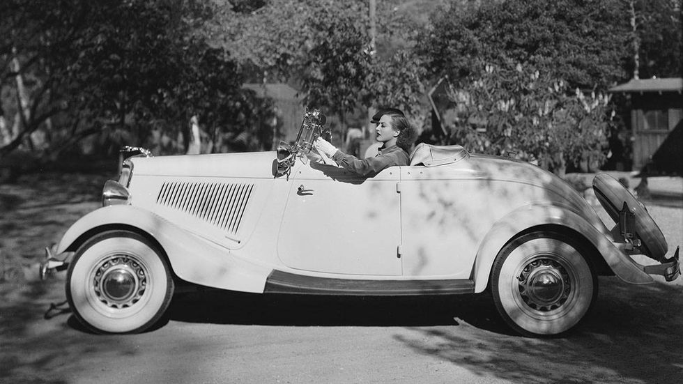 September 26th 1934 American actress Joan Crawford (1904-1977), goes for a drive in her 1934 Ford convertible.