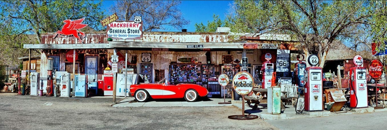 Red Vintage Corvette and Gas Station Pumps on Rt66 in Hackberry, Arizona.